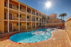 a swimming pool in front of a hotel at Coral Reef Club by Panhandle Getaways in Destin