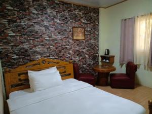 Ліжко або ліжка в номері Binalonan Transient/GUESTHOUSE (PENSION GLAYDIE)