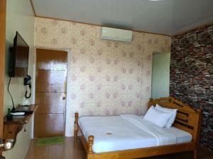 Кровать или кровати в номере Binalonan Transient/GUESTHOUSE (PENSION GLAYDIE)