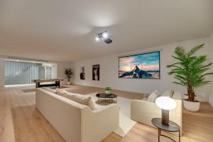 a living room with a white couch and a piano at VACATION MARBELLA I Villa Monte Halcones, Private-Pool, Brand-New, Incredible Views, Near Golf Valley in Benahavís