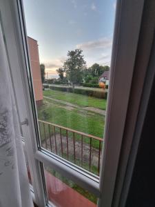 a window with a view of a yard at Wczasy-Leba in Wicko