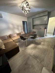 a living room with a couch and a table at Botabara Del Mar Boutique in Pomorie