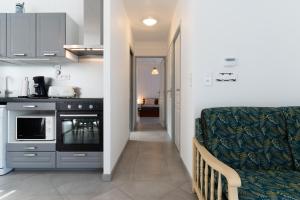 a kitchen with a table and a chair in a room at Bernard in Toulouse