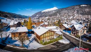 an aerial view of a town with snow covered buildings at Igloo in Morzine