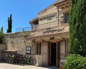 a group of bikes parked in front of a building at Apokryfo Traditional Guesthouse in Lofou