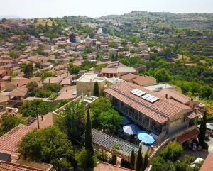 an aerial view of a village with a house at Apokryfo Traditional Guesthouse in Lofou