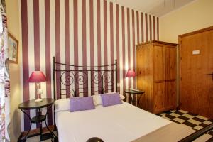 Postel nebo postele na pokoji v ubytování Málaga Lodge Guesthouse
