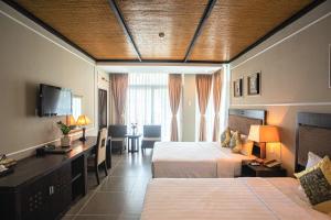 Postel nebo postele na pokoji v ubytování Seaside Resort Vung Tau