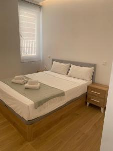 a bedroom with a bed with two towels on it at Exyca Bernabéu in Madrid