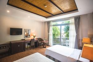 Postel nebo postele na pokoji v ubytování Seaside Resort Vung Tau