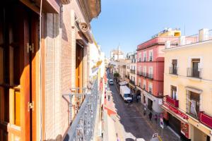a view of a city street from a building at AoA Green Gardens Family House in Seville
