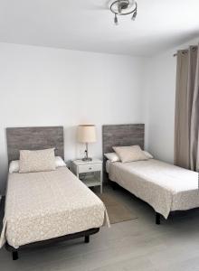 A bed or beds in a room at Villa Magnolia Még 33 kép