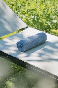 a blue rolled up towel sitting on a table at Schönherr Haus in Neustift im Stubaital