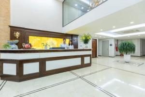 a lobby of a hotel with a reception counter at Hoang Gia Hotel Ha Noi Capital in Hanoi