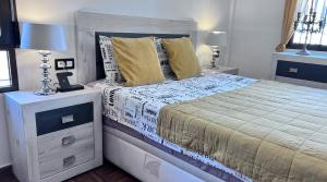 Łóżko lub łóżka w pokoju w obiekcie Casa de Holm