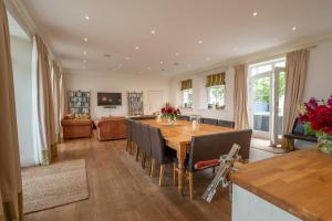 a dining room with a table and a couch at Alexander House 14 - East Wing - Self Catering in Auchterarder