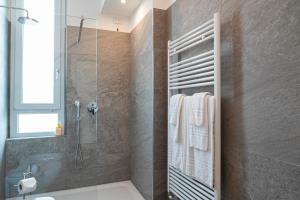 a bathroom with a shower and a toilet and a sink at Villa Tosati in Monza