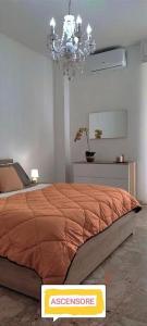 Ένα ή περισσότερα κρεβάτια σε δωμάτιο στο APPARTAMENTO DELIZIOSO CON TERRAZZO IN CENTRO-DELICIOUS APARTMENT WITH TERRACE