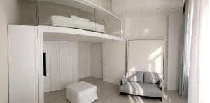 A bed or beds in a room at Duomo Inn