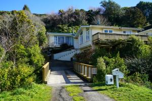 a house on the side of a hill at The Hidden Gem - tranquility close to town in Wellington