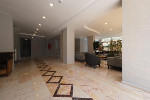 an empty lobby with chairs and a table in a building at Premier Inn City Antalya in Antalya