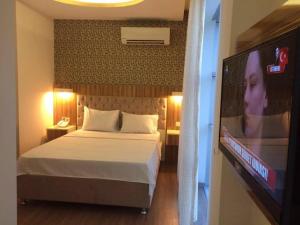 Una cama o camas en una habitación de Grand Mardin Hotel 29 fotos más