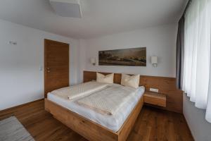 Łóżko lub łóżka w pokoju w obiekcie Gästehaus Fohringer