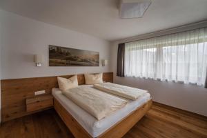 Łóżko lub łóżka w pokoju w obiekcie Gästehaus Fohringer