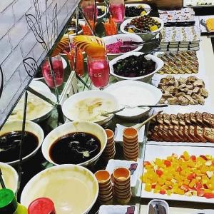 a buffet with many plates of food on a table at Grand Mardin Hotel in Mersin