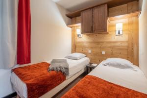 Ein Bett oder Betten in einem Zimmer der Unterkunft Résidence Pierre & Vacances Le Quartz