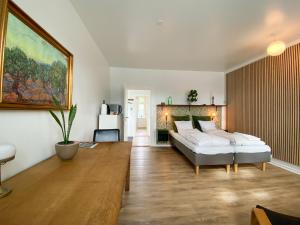 a living room with a couch and a table at Årslev B&B in Randers