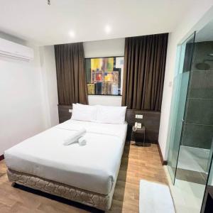 Postel nebo postele na pokoji v ubytování Frenz Hotel Kuala Lumpur