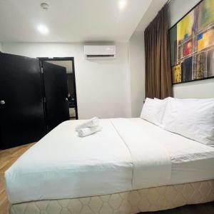 Postel nebo postele na pokoji v ubytování Frenz Hotel Kuala Lumpur