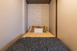 Cama ou camas em um quarto em Maru Taisho