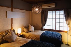 Cama ou camas em um quarto em Maru Taisho