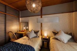 Cama ou camas em um quarto em Maru Taisho
