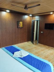 Postel nebo postele na pokoji v ubytování Hotel Pearl Residency