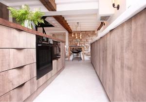 a hallway of a home with wooden walls and a table at Luxury Cottage in Peak District near Alton Towers in Stanton