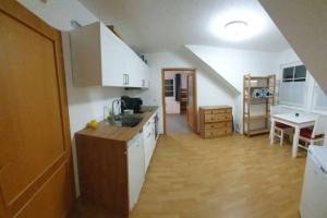 Kuchyň nebo kuchyňský kout v ubytování Gemütliche Ferienwohnung + 6 fotografií