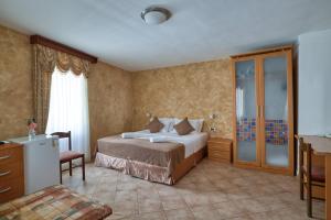 Postel nebo postele na pokoji v ubytování Hotel Rendez Vous