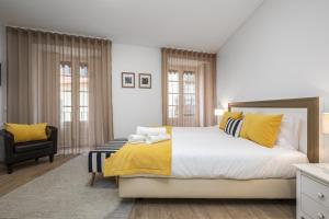 Postel nebo postele na pokoji v ubytování Studios Funchal by Homing