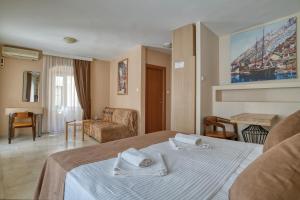 a hotel room with a bed with towels on it at Hotel Rendez Vous in Kotor