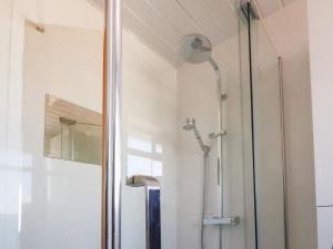 a shower in a bathroom with a glass door at 26 North Promenade in Cleveleys