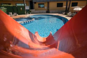 a swimming pool with a slide in a resort at Apartamentos Atlántico Resort in Montalvo +124 photos