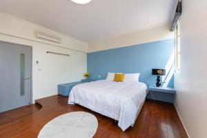 מיטה או מיטות בחדר ב-Slow Pine Homestay