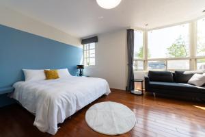 מיטה או מיטות בחדר ב-Slow Pine Homestay