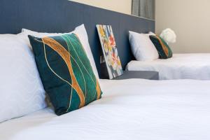 מיטה או מיטות בחדר ב-Slow Pine Homestay