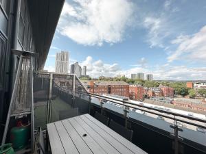 a balcony with a view of a city at Luxury 3 Bedroom Apt. Leeds Centre in Leeds