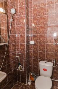 a bathroom with a toilet and a shower at Луксозен апартамент Далия in Varna City