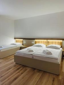Posteľ alebo postele v izbe v ubytovaní Apartmány Hrabovo Zuzana
